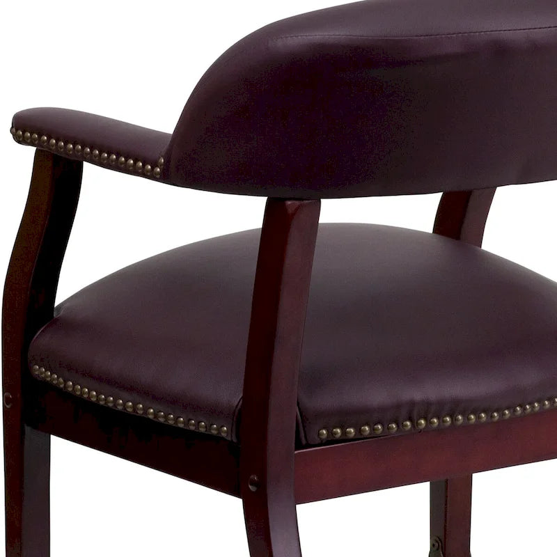 Fauteuil de conférence avec garniture cloutée et roulettes